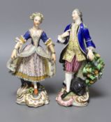 A pair of Derby figures of dancers, both elegantly dressed, incised N317 and blue crossed swords