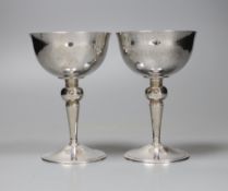 A pair of hammered silver wedding goblets, Leslie Gordon Durbin, London 1983, 11cm