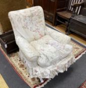 A Victorian mahogany armchair, upholstered faded beige foliate fabric, width 82cm, depth 80cm,