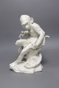 A “Vienna’’ white glazed porcelain model of monkey, seated on a tree bough, 32cm