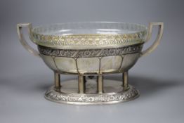 An early 20th century Continental white metal two handled centrepiece bowl, with engraved floral