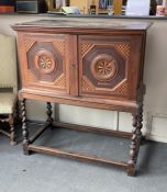 A 17th century style parquetry inlaid walnut cabinet on stand, with two doors enclosing three long