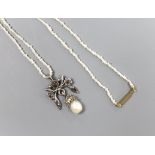 An Indian rose diamond and baroque pearl white metal mounted drop pendant, on a seed pearl necklace