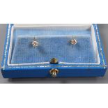 A pair of 750 yellow metal and solitaire diamond set ear studs, gross weight 0.9 grams, each stone