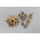 An Edwardian 9ct gold seed pearl and simulated ruby starburst brooch, 3.25cm, a pearl set bar brooch