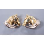 A pair of diamond set 18ct gold horse head ear clips, 2cm, gross 9.8 grams
