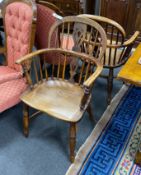 A pair of mid 19th century yew and elm Windsor elbow chairs, with crinoline stretchers, width