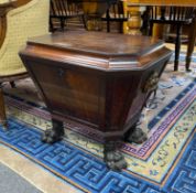 A Regency and later mahogany sarcophagus wine cooler on cast metal lions paw feet, width 56cm, depth