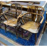 A near pair of mid 19th century yew and elm Windsor elbow chairs, with crinoline and H stretcher,