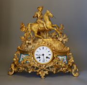 A French gilt metal figurative mantel clock with key and pendulum, 37cms high