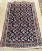 A North West Persian blue ground rug, 160 x 103cm