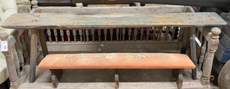 A primitive part painted fruitwood bench, length 150cm, height 48cm together with a smaller fender