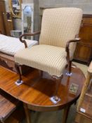 A George II style mahogany upholstered open armchair