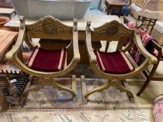 A pair of renaissance style giltwood and composition X frame elbow chairs, width 72cm, depth 51cm,
