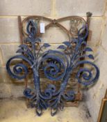A pair of painted wrought iron wall appliques, height 92cm together with a wrought iron gate