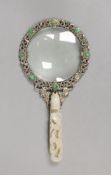 An Eastern white metal ‘SILVER’ marked magnifying glass with carved jade belt hook handle, total