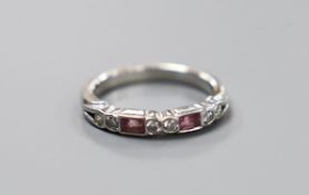 A modern platinum, two stone pink sapphire and six stone diamond set half hoop ring, size H, gross