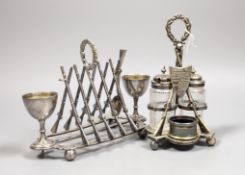Two plated rifle trophies: toastrack and cruet set, tallest 20cm