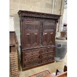 A large Flemish oak two part hanging cupboard, length 154cm, depth 55cm, height 219cm