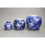 Three Chinese blue and white prunus blossom jars, tallest 17cm