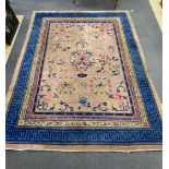 An early 20th century Chinese lilac ground carpet, 330 x 240cm