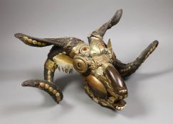 A Buddhist decorated ram's skull with brass decor, 20cm tall