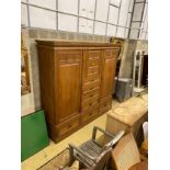 A late 19th century German Art Nouveau oak compactum wardrobe, length 224cm, depth 56cm, height