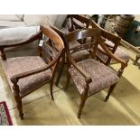 A set of six Indonesian hardwood dining chairs, two with arms