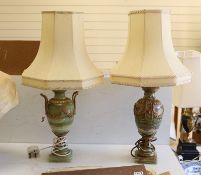 A pair of early 20th century brass mounted onyx urn shaped lamps, 35cm high not including light