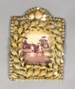 A Victorian shell encrusted photograph frame, 20cm tall