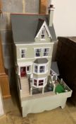 A good quality modern painted wood doll's house, modelled as a Victorian four storey villa, width