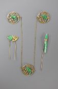 A yellow metal and jade mounted three section circular cloak? brooch, each jade carved as a bird,