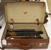 Eight Victorian truncheons, mostly painted, in suitcase