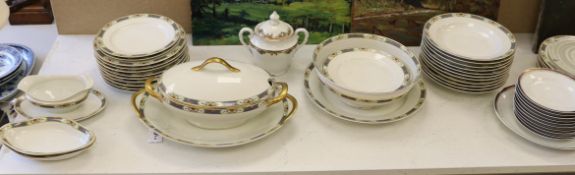 A Limoges gilt and floral decorated dinner service,