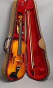 A cased child's violin and bow with ivorine tip, violin 55cms long,