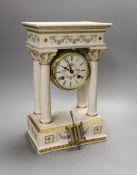 A modern ceramic portico column clock with floral and gilt decoration, with key and pendulum, 37cm