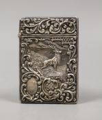 An Edwardian embossed silver card case, decorate d with stag in highland scene, Crisford & Norris,