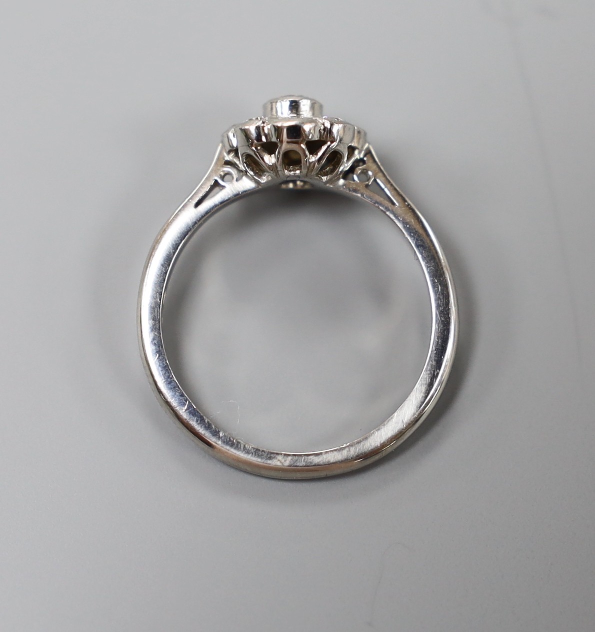 A modern platinum and collet set nine stone diamond flower head cluster ring, size O, gross weight - Image 3 of 3