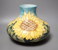 A Moorcroft pottery vase of compressed form, decorated in the "Sunflower" pattern, 20cm