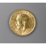 A George V 1913 gold sovereign.