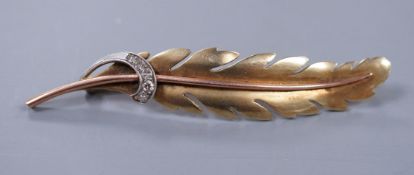 A 1940's Continental two colour gold and diamond feather bar brooch, 6.25cm. gross 7.6 grams