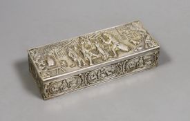 An early 20th century Dutch white metal casket, decorated with figures outside a tavern, 15.5cm