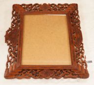 A Chinese carved sandalwood picture frame, 36x41 cm total
