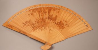A Chinese penwork sandalwood fan