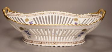 A Haviland Limoges fruit basket, painted with trailing flowers, 41cm