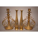 A pair of Victorian brass candlesticks and a pair of Arabic brass posy vases, tallest 25cm