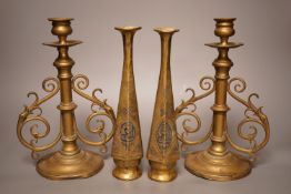 A pair of Victorian brass candlesticks and a pair of Arabic brass posy vases, tallest 25cm