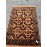 An Afghan gold ground rug, 186 x 124cm