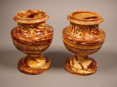A pair of 19th century 'solid agate' pottery urns 14cm