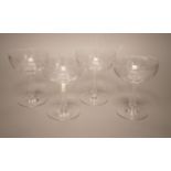 A set of four facet cut hollow stemmed champagne glasses